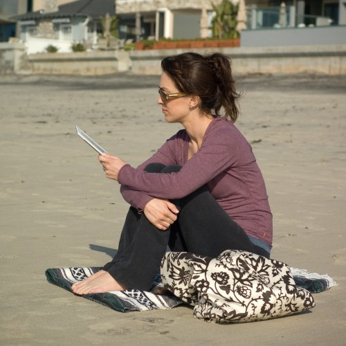 lady reading Kindle on beach