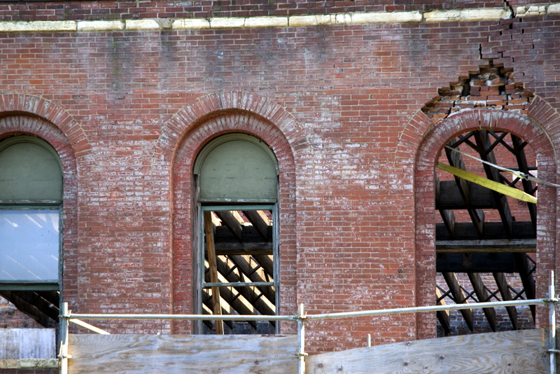 Through the window of the portion of the building that will be saved