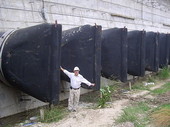 Municipal size check valve with engineer standing in front for perspective