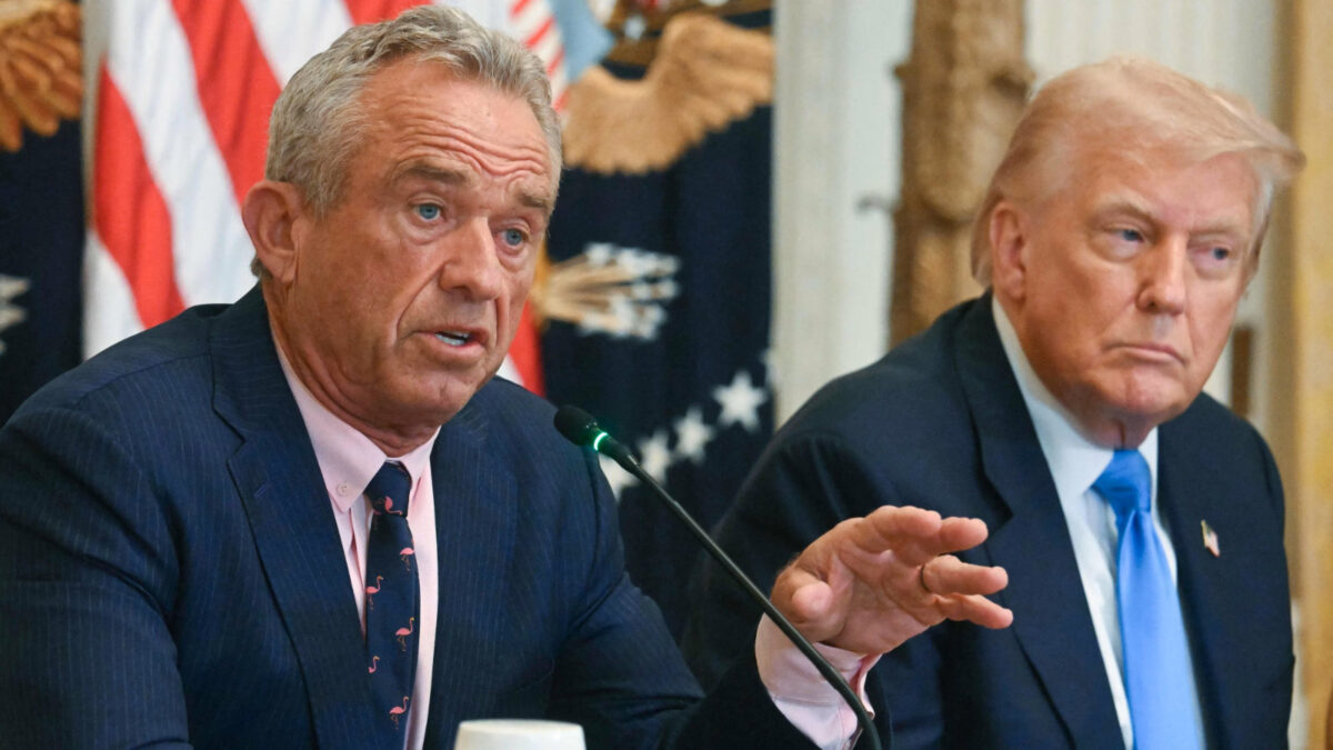 RFK Jr and Trump sitting side by side, RFK Jr is talking and gesturing with his hand