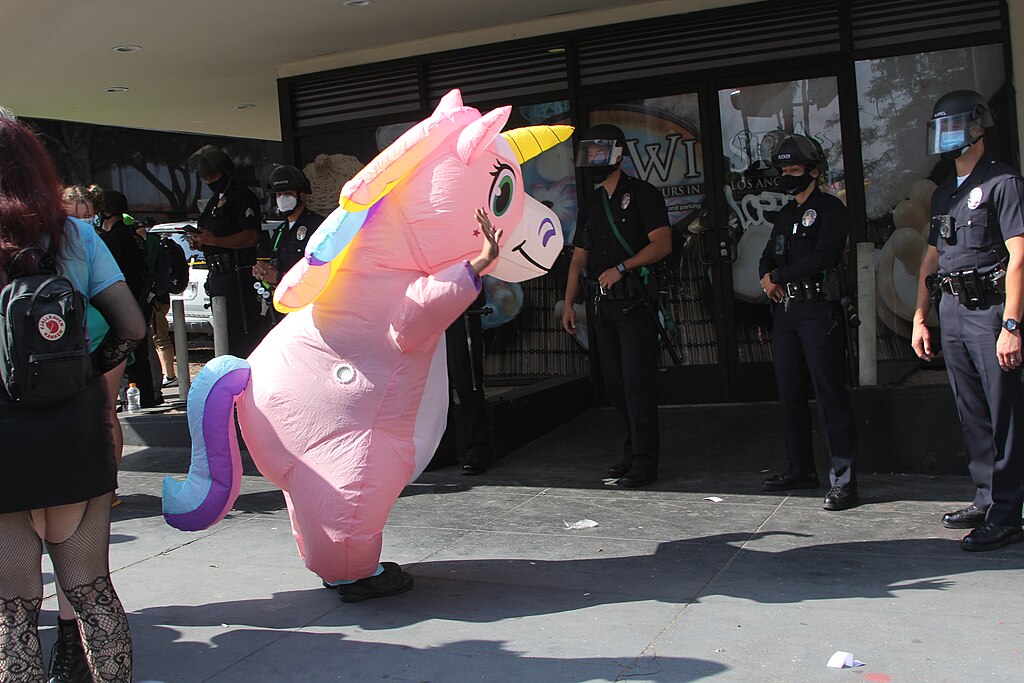 Rainbow Unicorn costumed protester at ICE