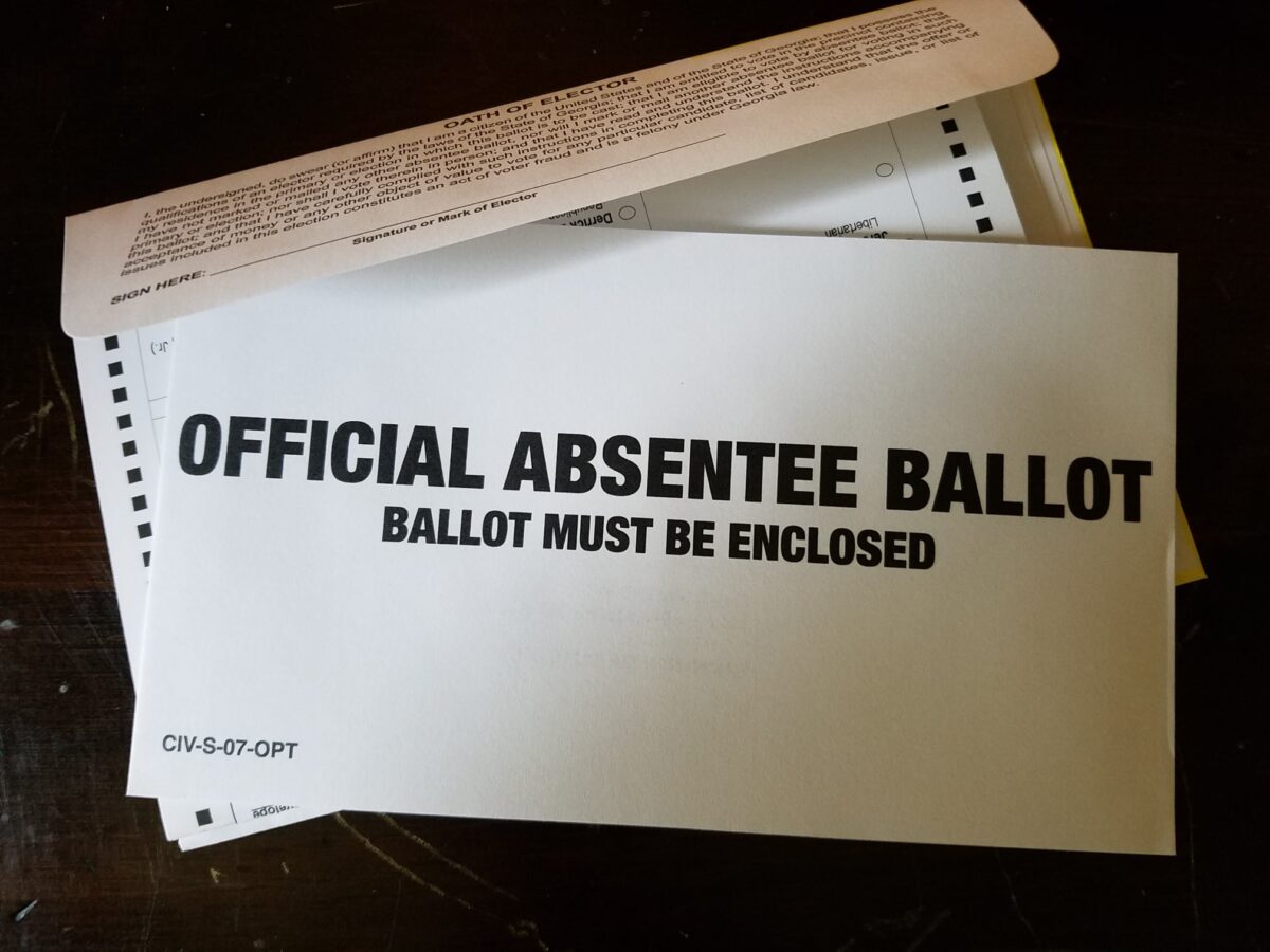 Photos of an absentee ballot return envelope